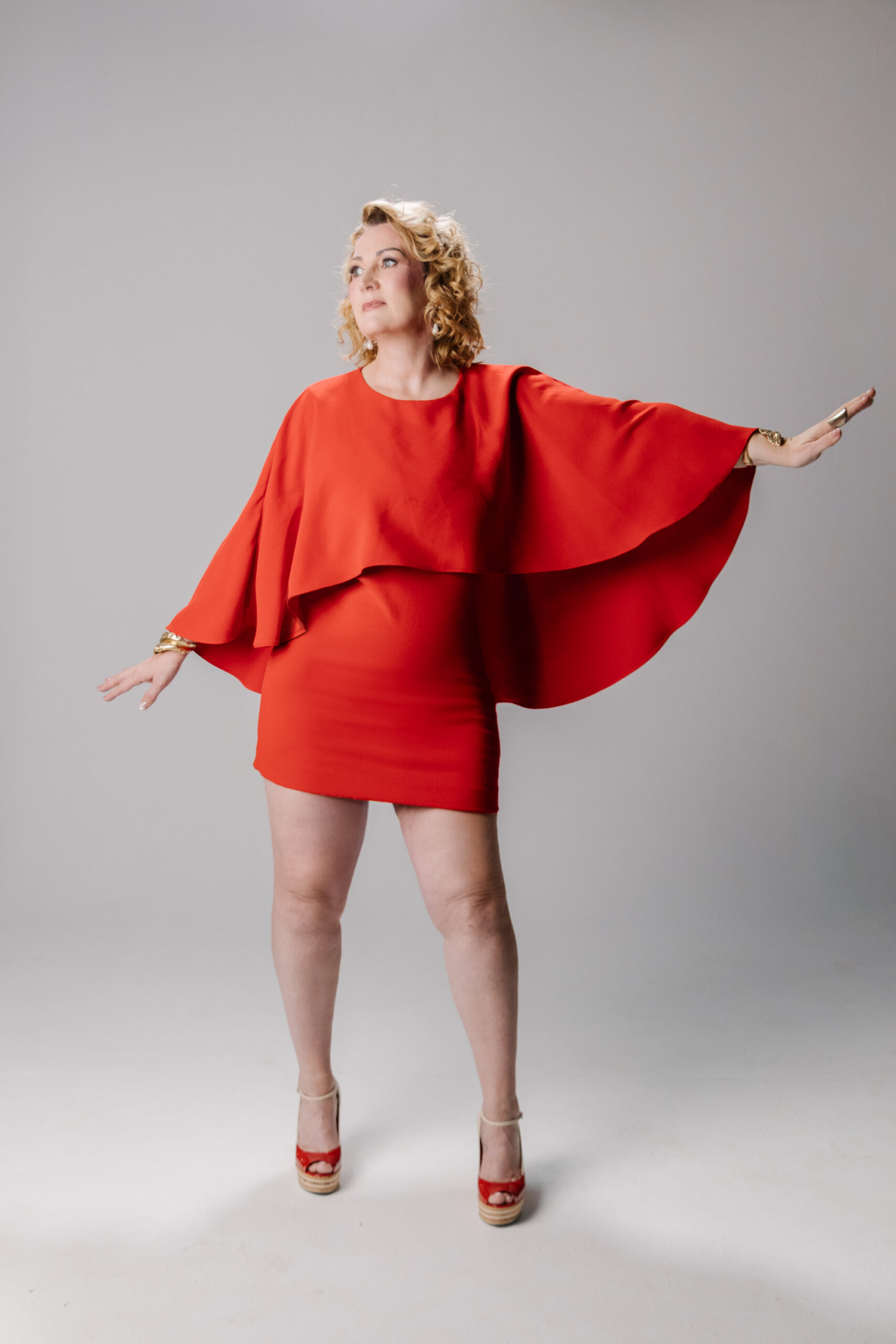 kd red dress cape to the side